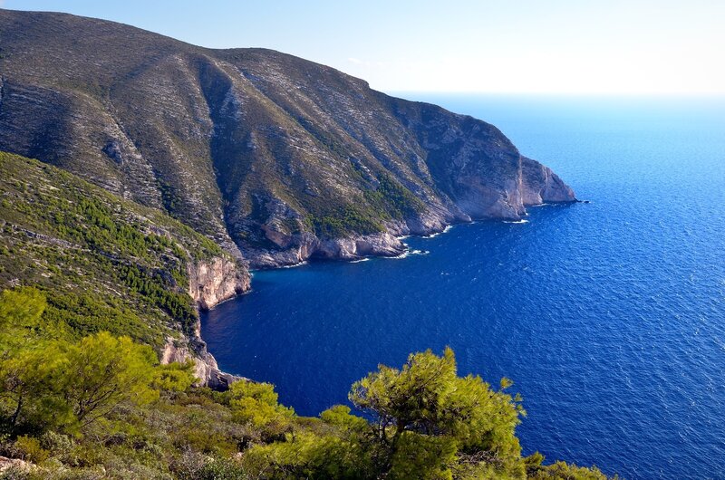 Cliffside Coastline — Blue, Serene, Afternoon, Photograph, Sea, Mountain, Trees, Green