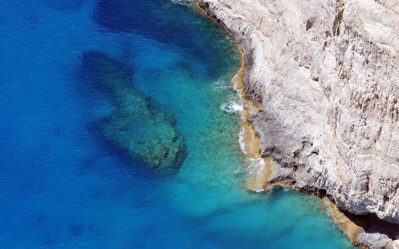 Cliffside Coastline — Blue, Serene, Afternoon, Photograph