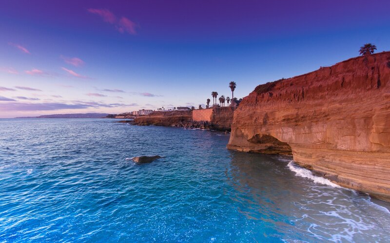 Cliffside Coastline — Blue, Serene, Sunset, Photograph