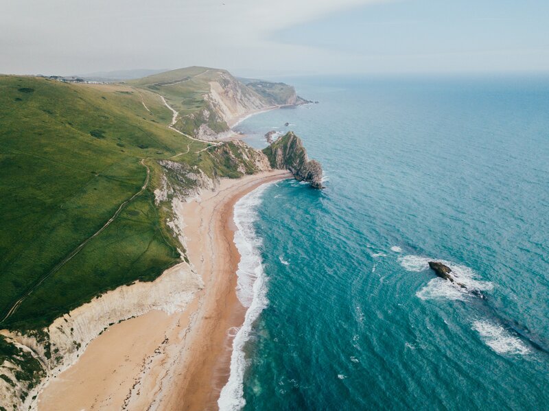 Cliffside Coastline — Green, Serene, Afternoon, Photograph