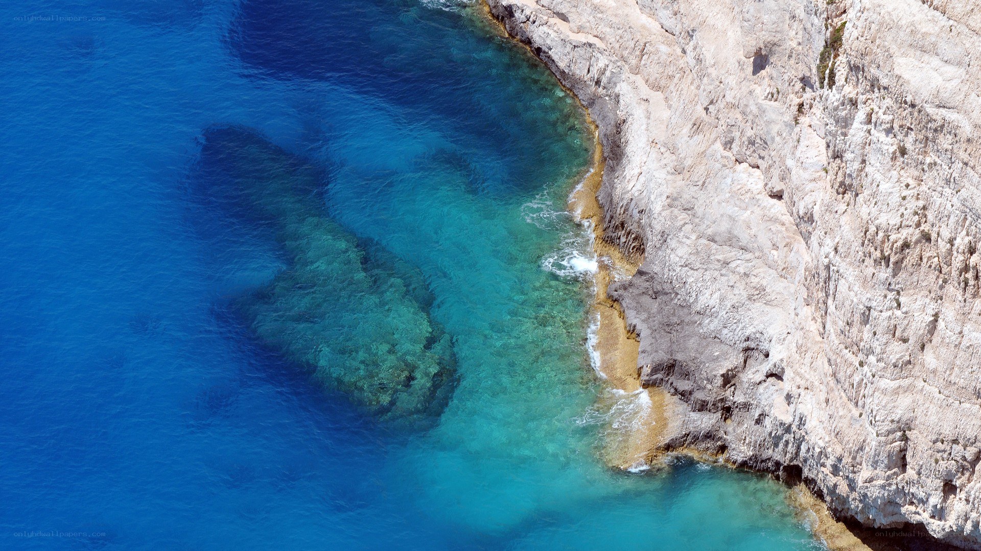 cliffside coastline with clear blue water