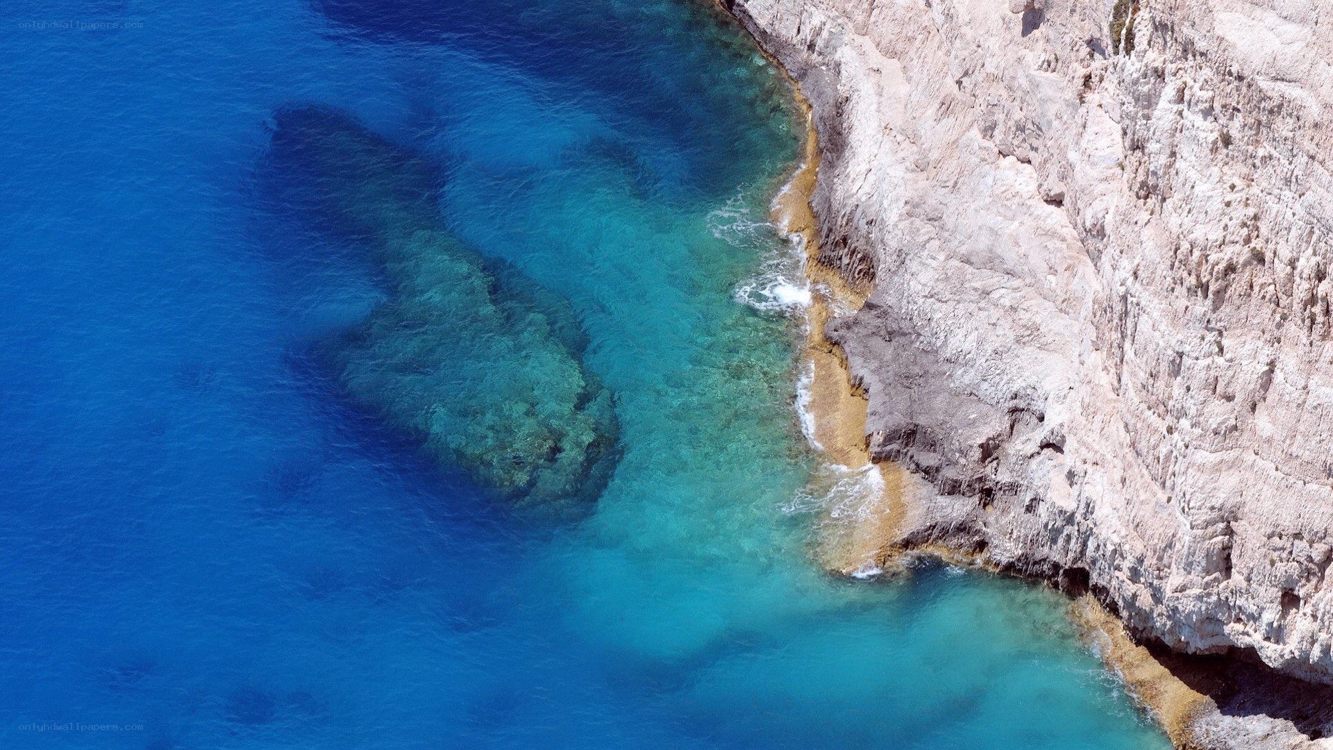 cliffside coastline with clear blue water