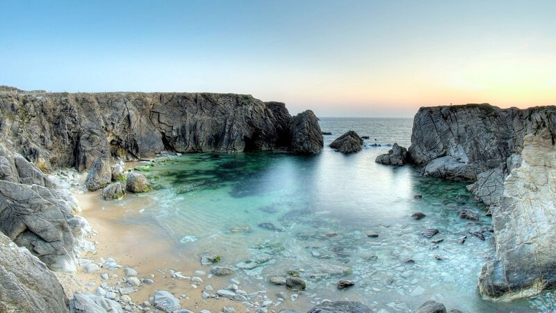 cliffside cove at sunset