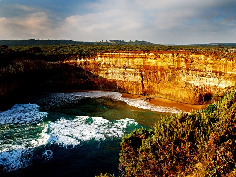 cliffside cove at sunset