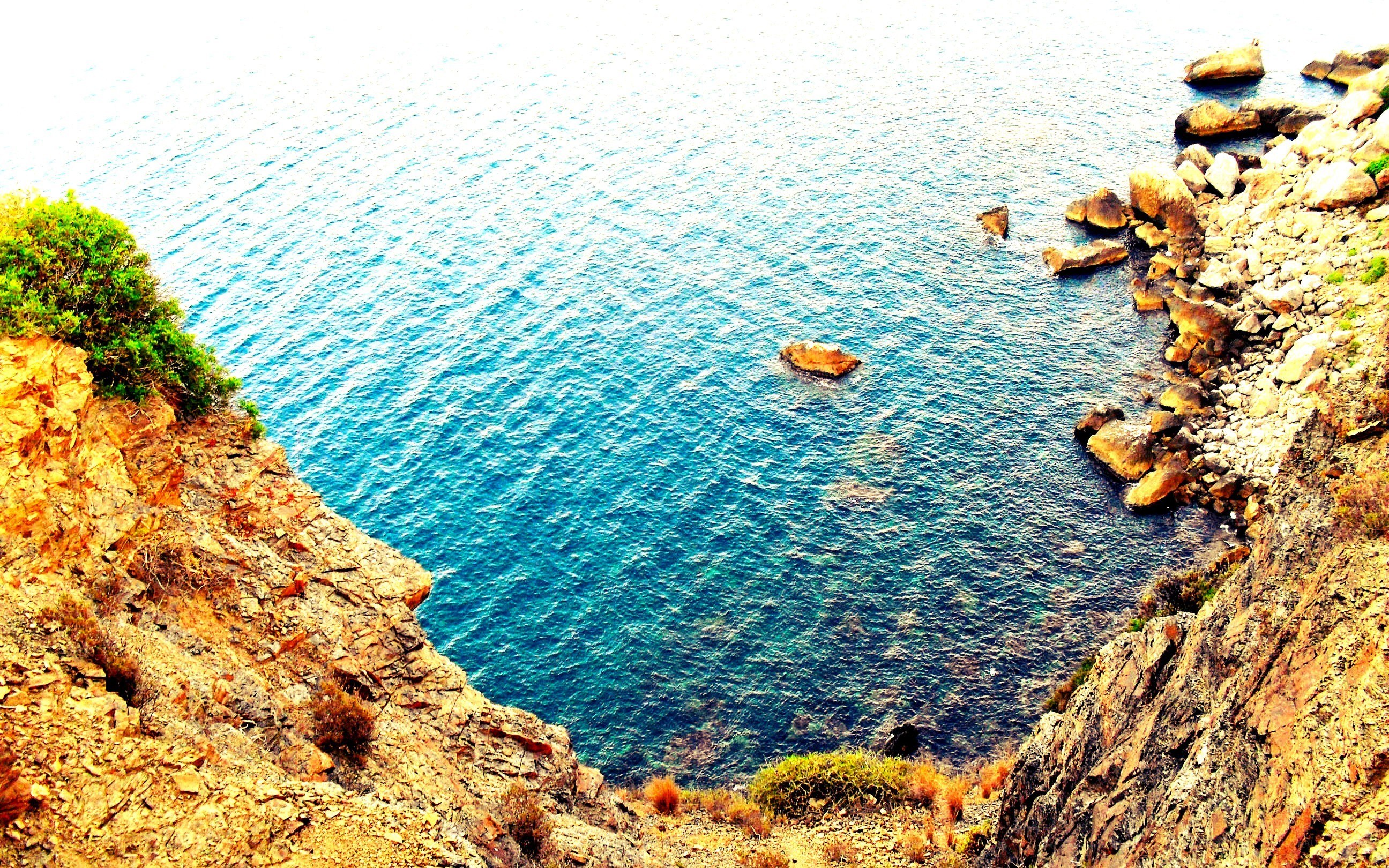 cliffside cove with blue water