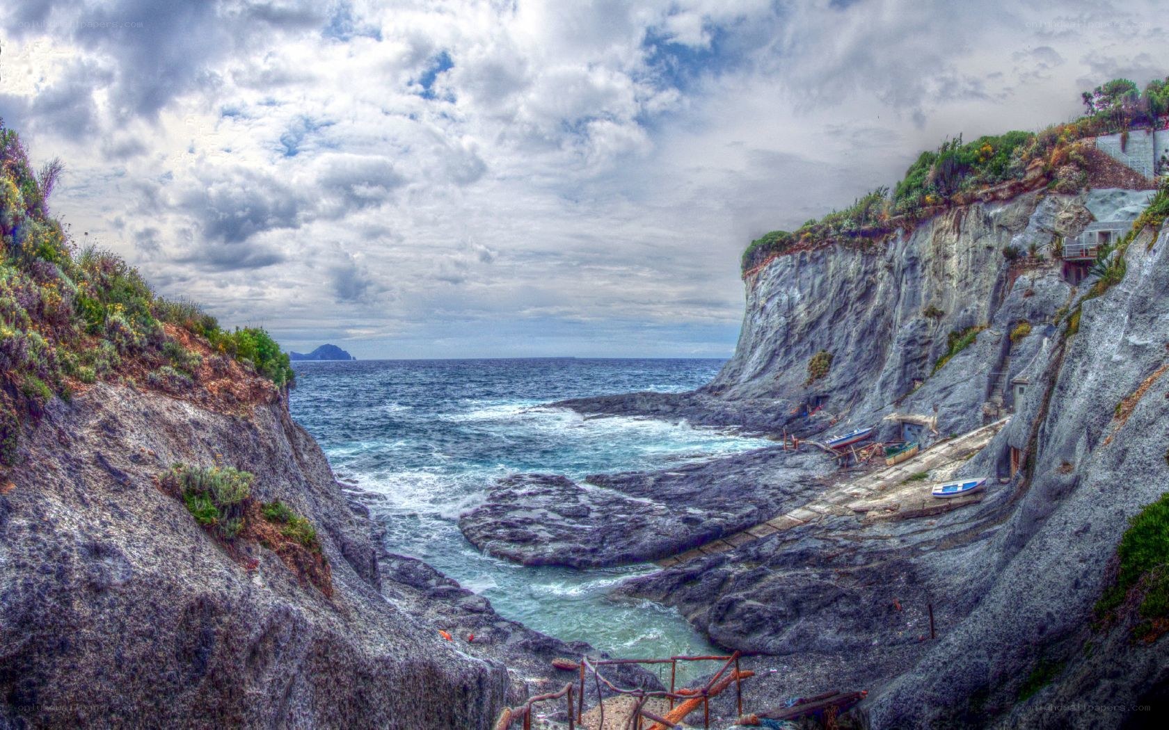 cliffside cove with boats