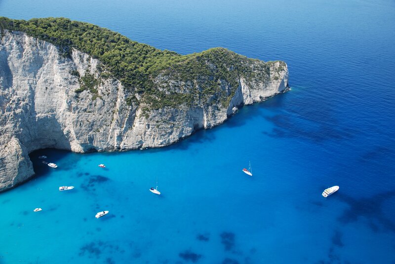 Cliffside Cove with Boats — Blue, Serene