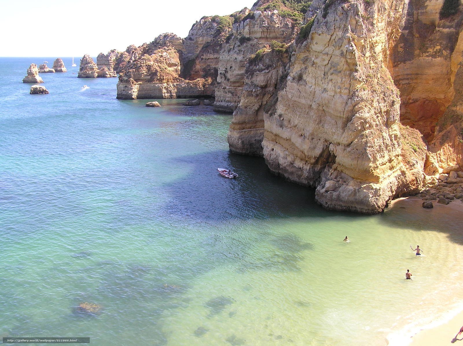 cliffside cove with boats