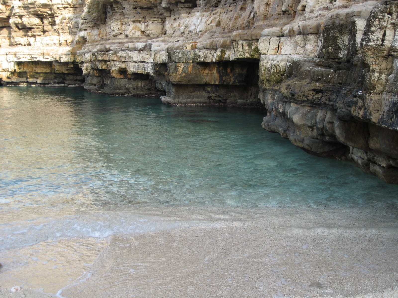 cliffside cove with clear water