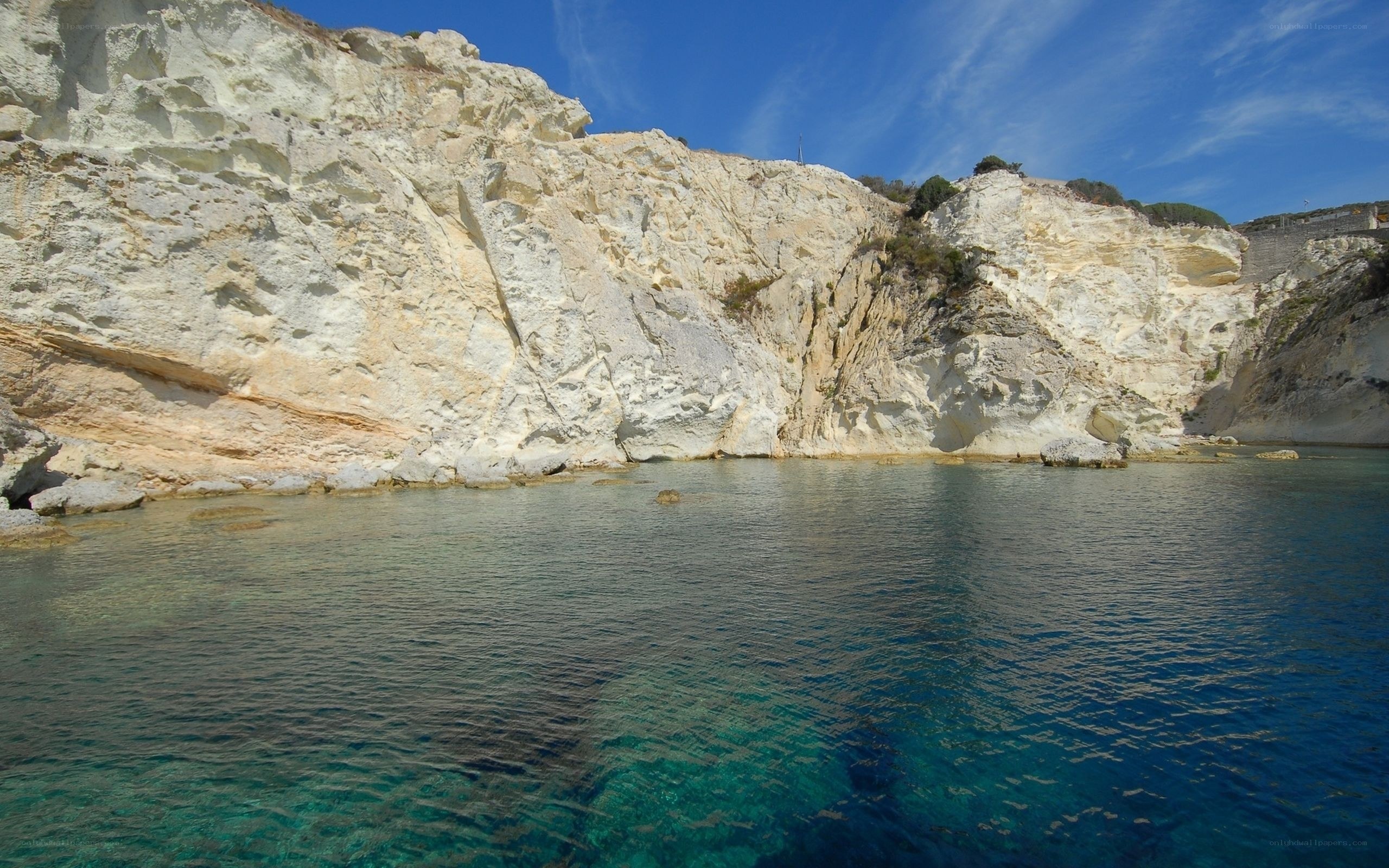 cliffside cove with clear water