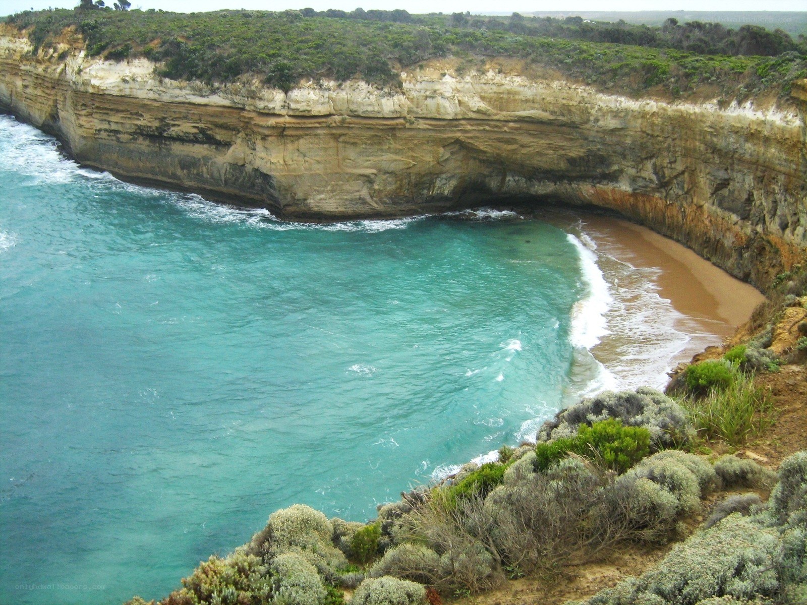 cliffside cove with turquoise water