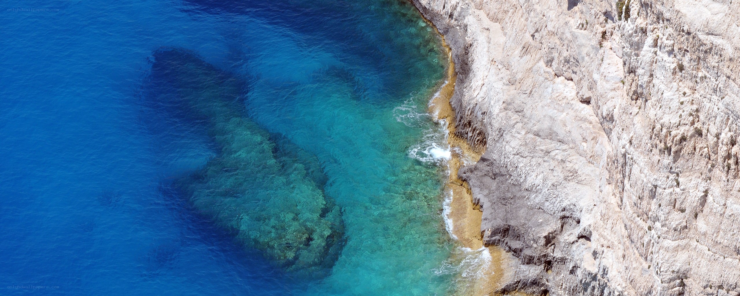 cliffside cove with turquoise water