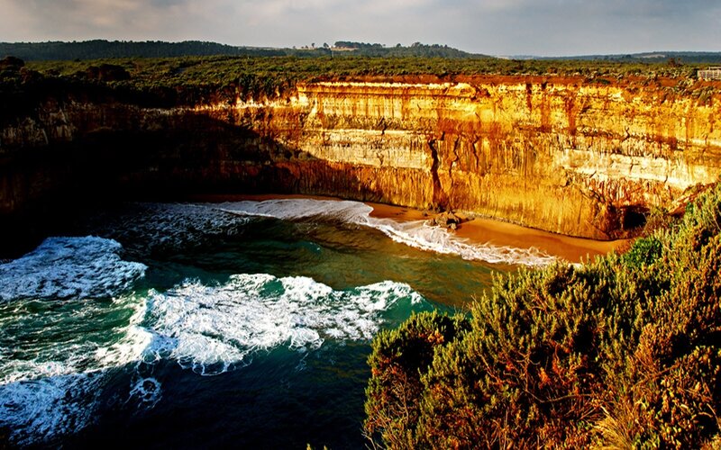 Cliffside Cove with Waves