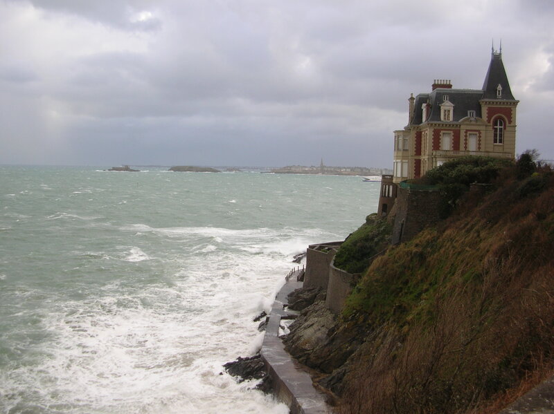cliffside house during storm