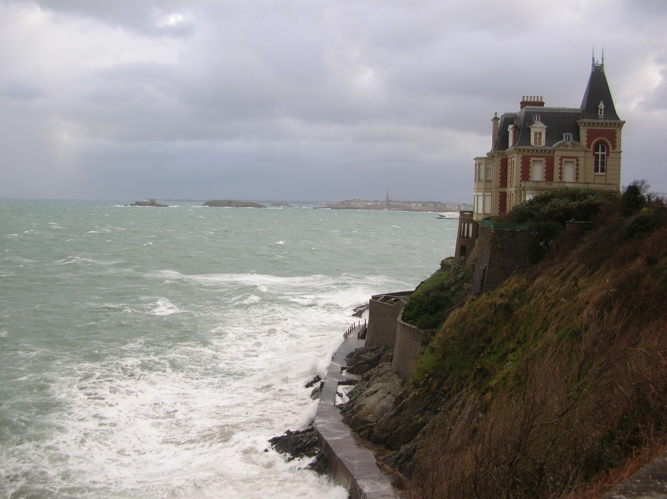 cliffside house during storm