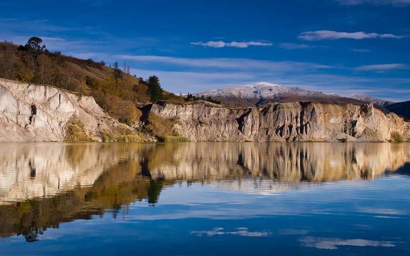 Cliffside Lake Reflection — Blue, Serene, Afternoon, Photograph
