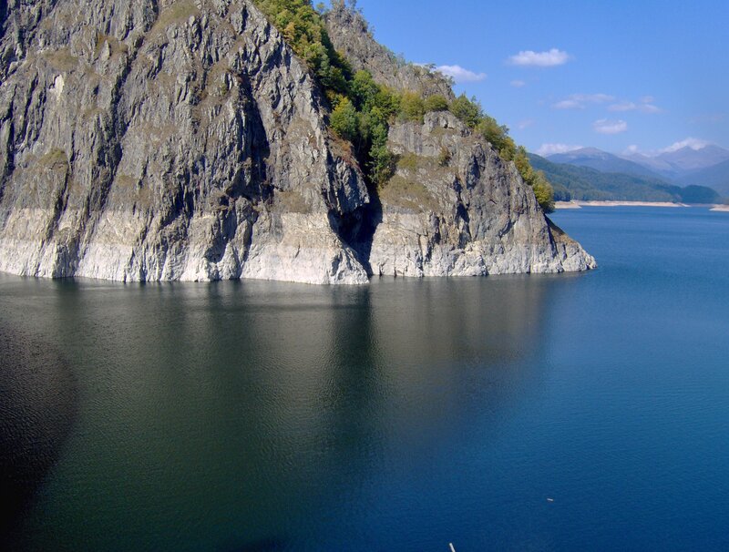 Cliffside lake with mountains