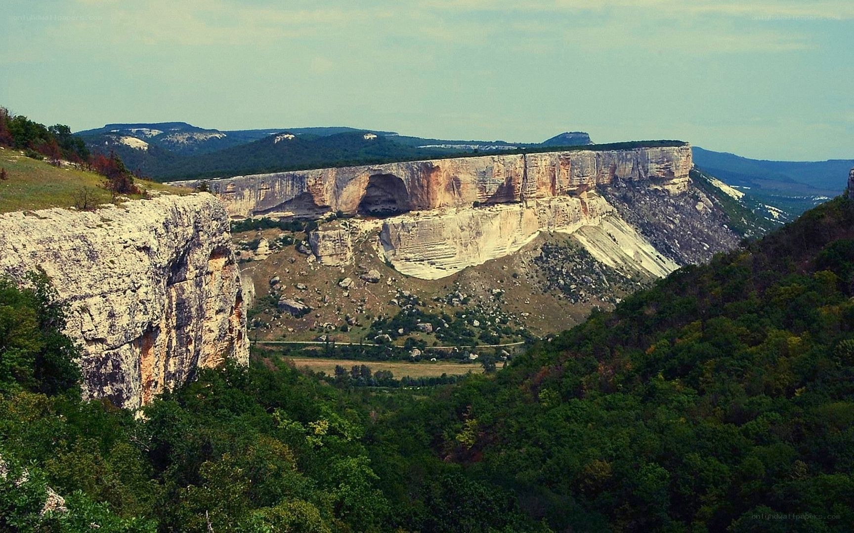 cliffside landscape with natural arch