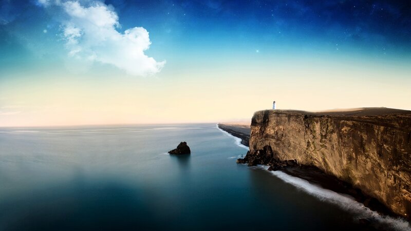 Cliffside lighthouse at dusk