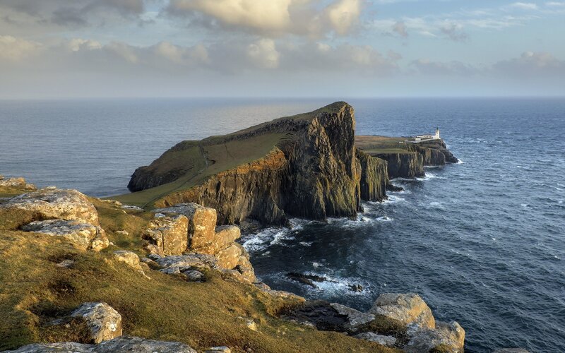 Cliffside Lighthouse — Blue, Dramatic, Afternoon, Photograph