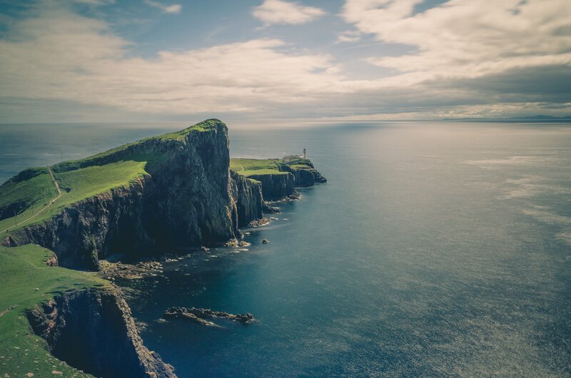 Cliffside Lighthouse — Blue, Serene, Afternoon, Photograph, Ocean
