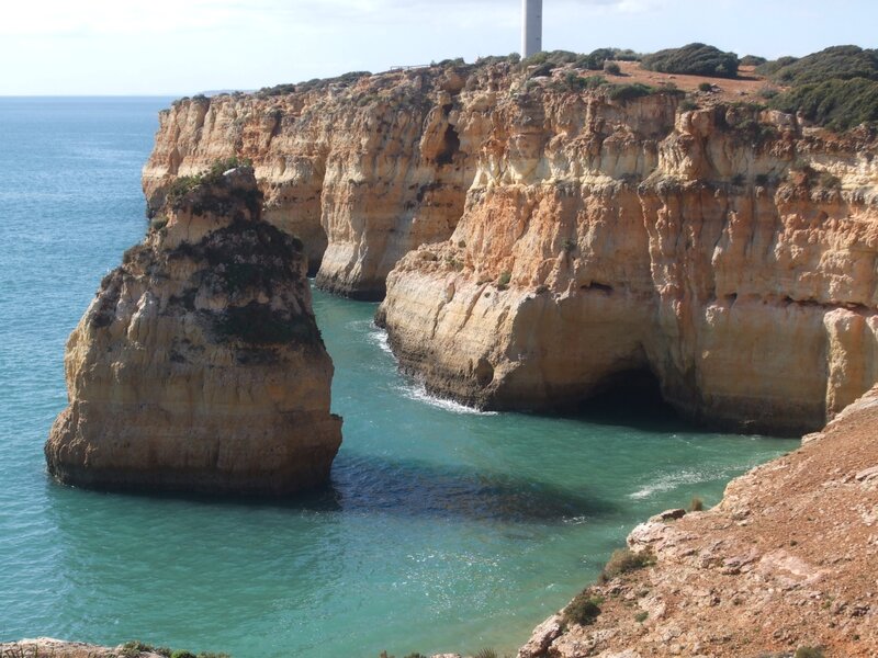 Cliffside Lighthouse — Blue, Serene, Afternoon