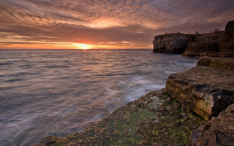 Cliffside Ocean Sunset — Orange, Dramatic, Photograph, Sky