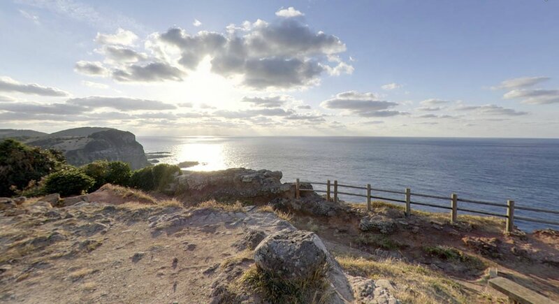 cliffside ocean view at sunrise