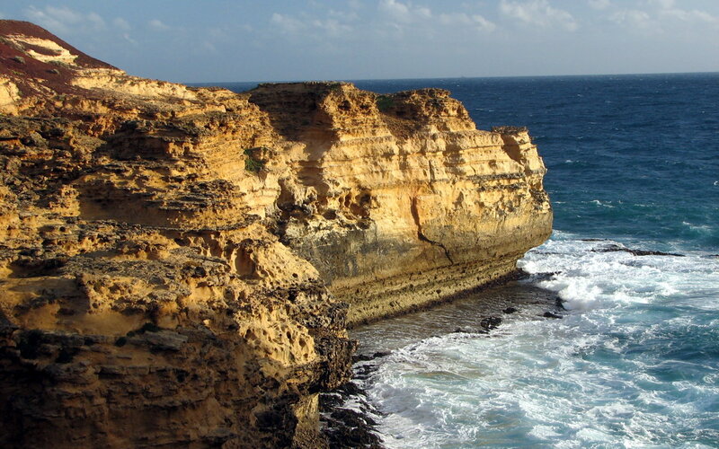 Cliffside Overlooking Ocean — Blue, Dramatic