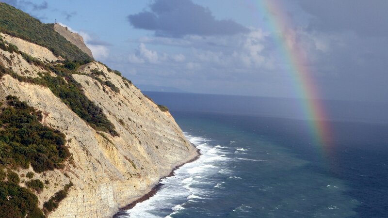 Cliffside Rainbow over Ocean — Blue, Dramatic, Afternoon, Photograph, Cliffs