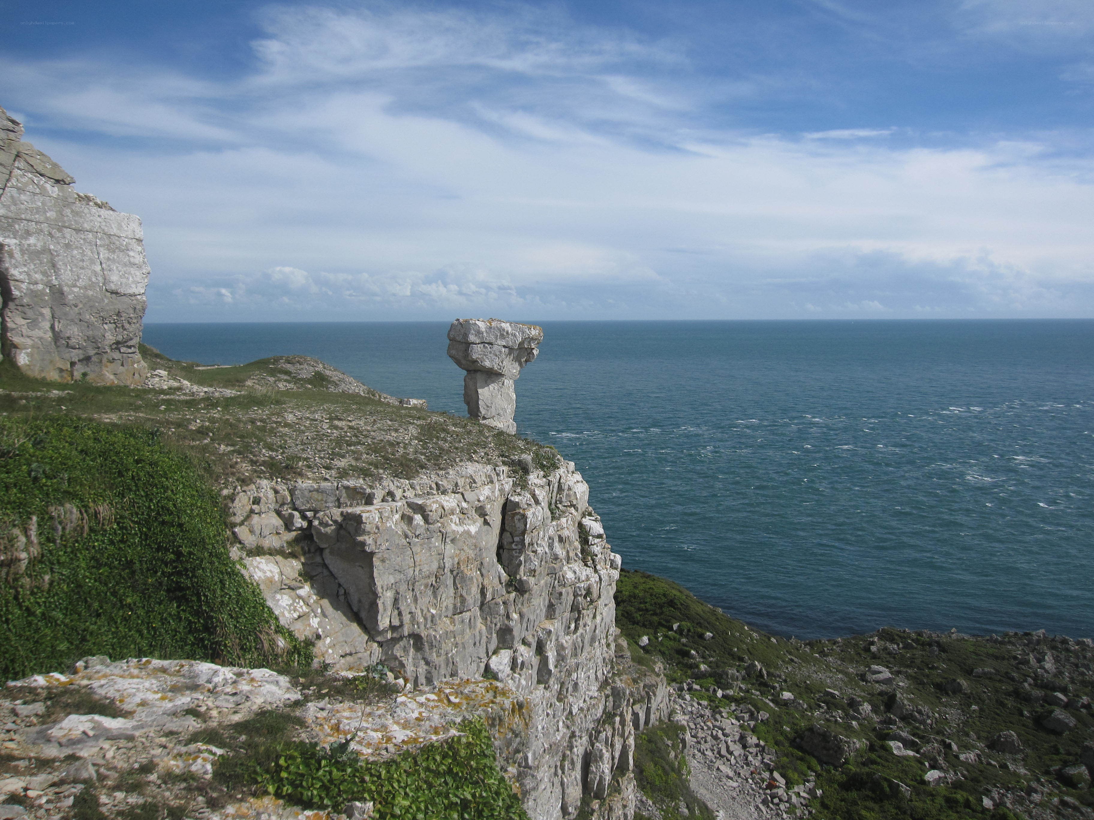 cliffside rock formation by the sea