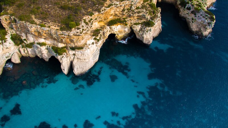 Cliffside Sea Caves — Blue, Serene