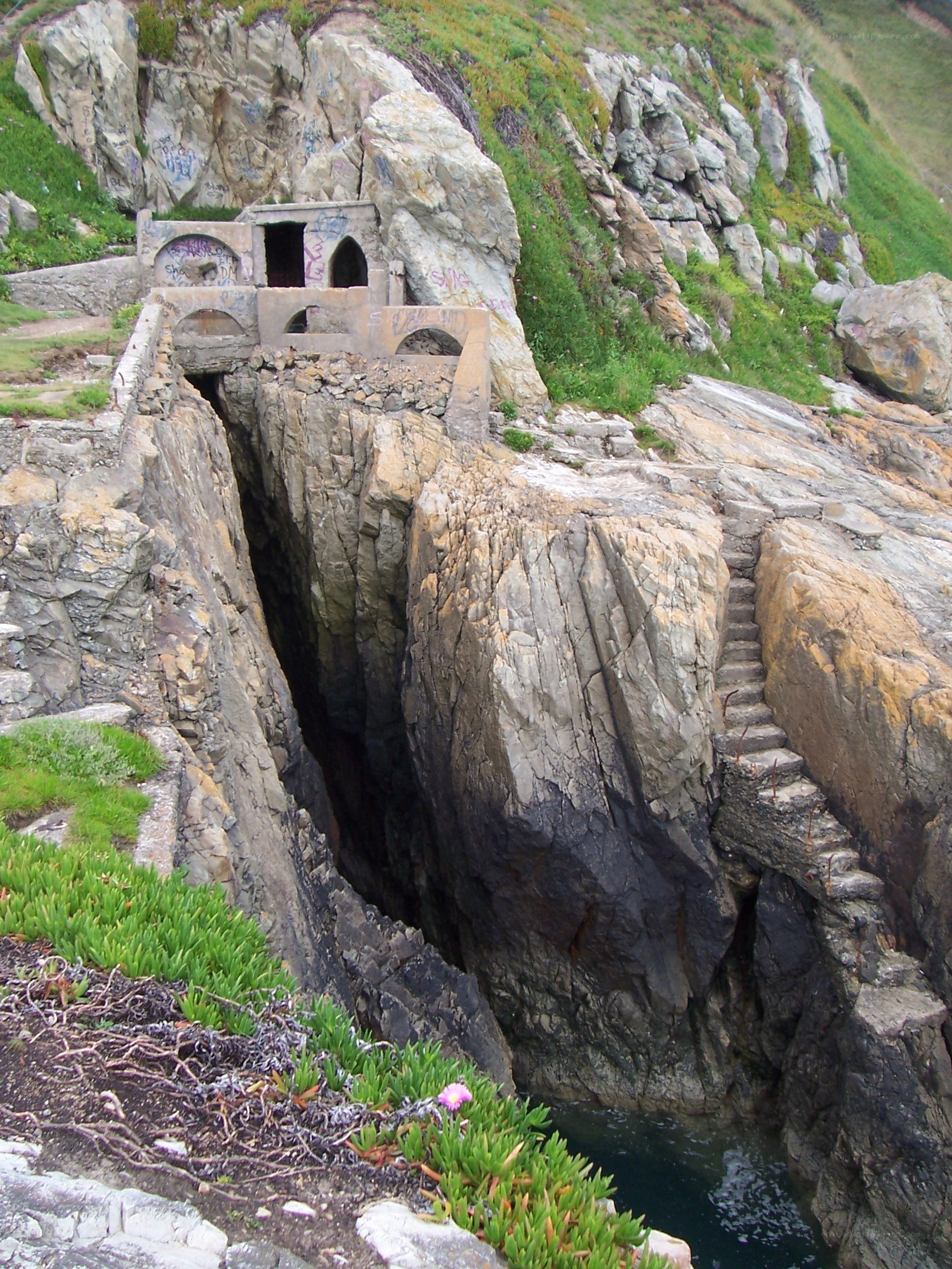 cliffside stone structure with stairs