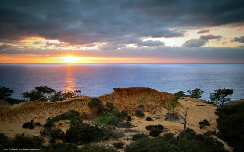 Cliffside Sunset over Ocean — Orange, Dramatic, Photograph
