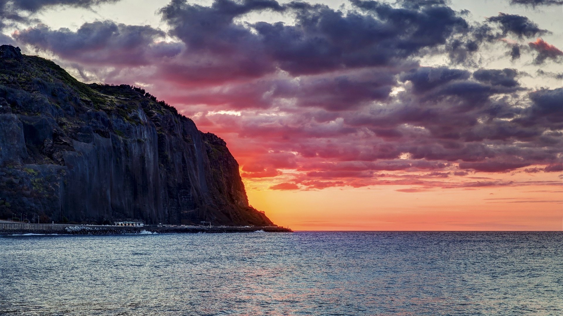 Cliffside sunset over the ocean