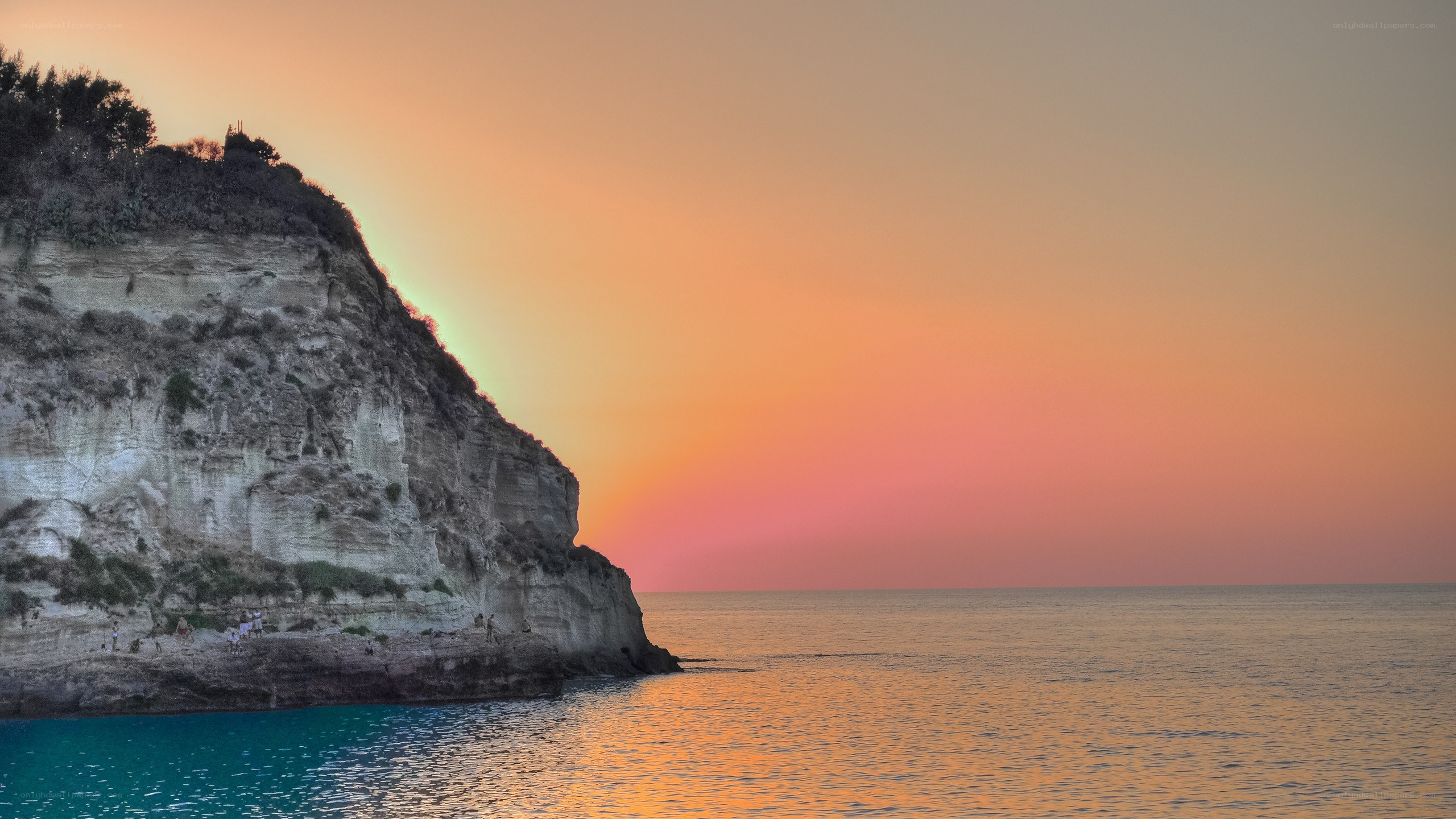 Cliffside sunset over the sea