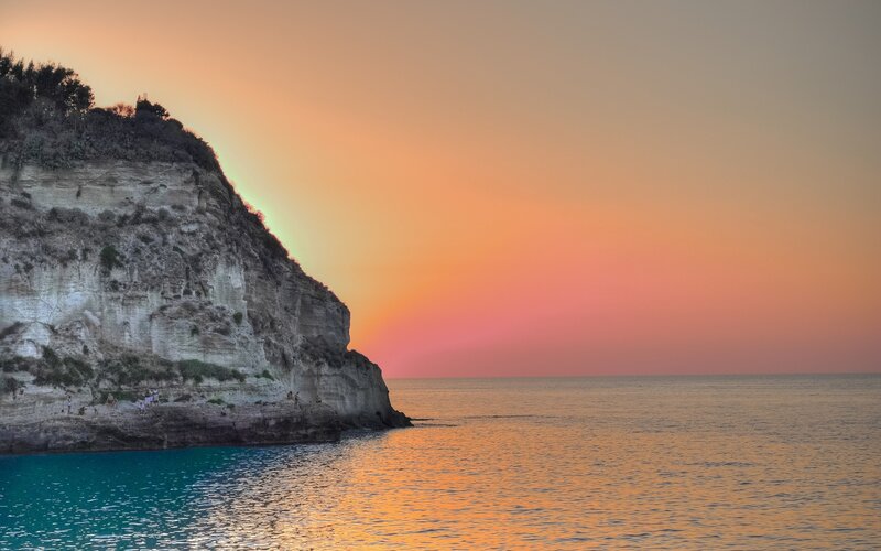 cliffside sunset over the sea