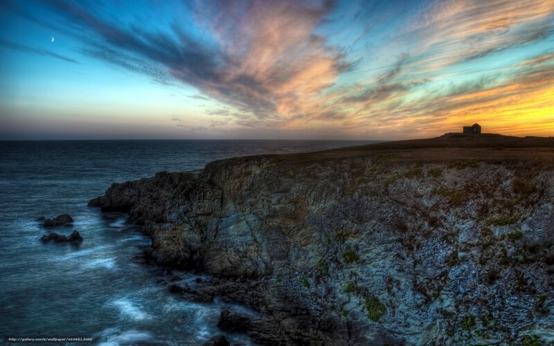 Cliffside sunset with moon