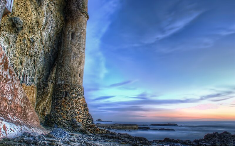Cliffside tower at sunset