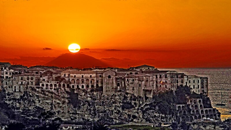Cliffside Town at Sunset — Orange, Dramatic