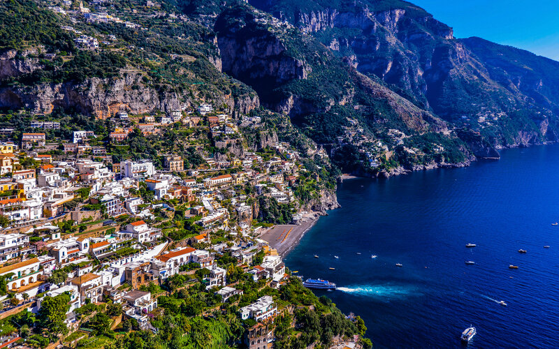 Cliffside Town by Sea — Blue, Serene, Afternoon, Photograph, Buildings