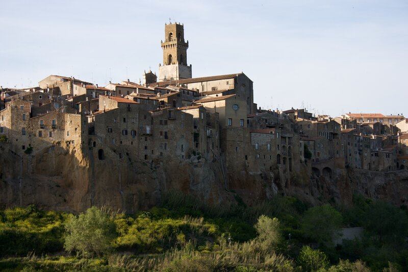 cliffside town with bell tower