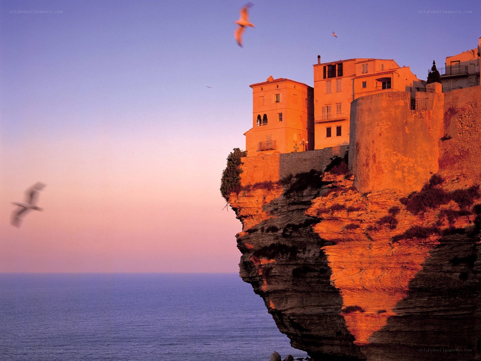 Cliffside village at sunset