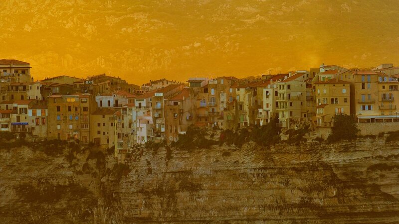 Cliffside Village at Sunset — Orange, Dramatic, Photograph, Buildings