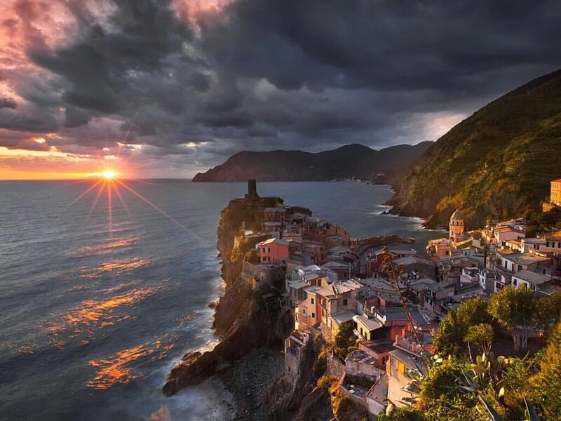 Cliffside Village at Sunset — Orange, Dramatic, Photograph
