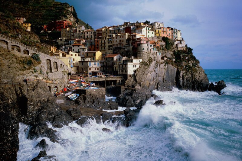 Cliffside Village by Sea — Blue, Dramatic, Afternoon, Photograph, Buildings, Ocean