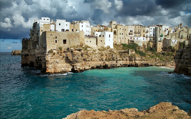 Cliffside Village by Sea — Blue, Dramatic, Afternoon, Photograph, Buildings