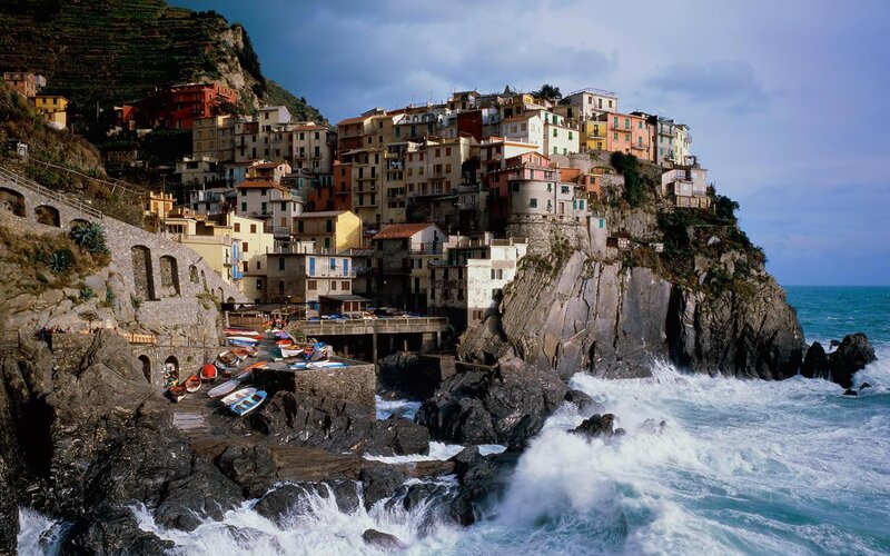 Cliffside Village by Sea — Blue, Dramatic, Afternoon, Photograph, Houses