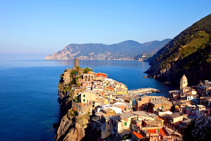 Cliffside Village by Sea — Blue, Serene, Afternoon, Photograph, Mountains