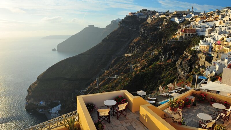 Cliffside Village Overlooking Sea — White, Serene